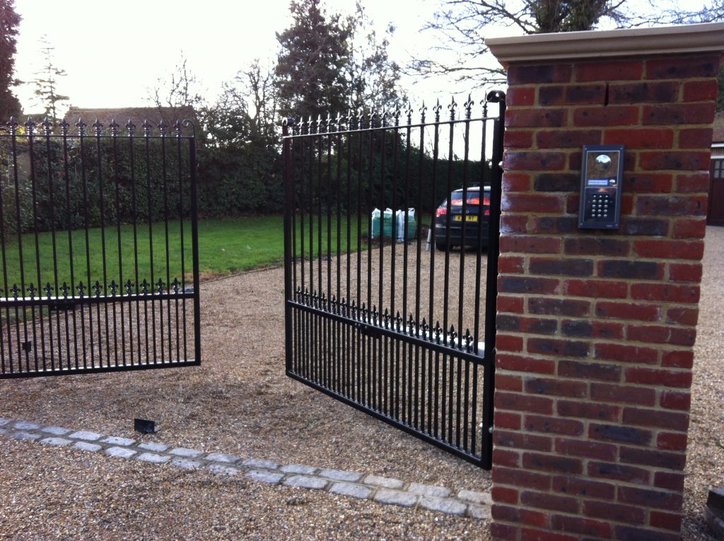 Opened metal automatic gate with numberpad entry system Astra Security Systems